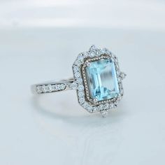 The default design option features 9x7mm Emerald Cut Aquamarine, VVS1-Clarity, VG-Cut, Ex-Polish, VG-Symmetry Set D-Colorless Moissanite Accent Stones in 14K White Gold Engagement Ring. Model 587-9x7mm Also you can fully customize and engrave this ring by clicking the button "Personalize in 3D". - As well please remember it takes up to 19-21 days to make and ship this item. Aquamarine Solitaire Ring, Emerald Cut Halo, Vintage Halo, Aquamarine Ring, Aquamarine Rings, White Gold Engagement, White Gold Engagement Rings, Natural Aquamarine, Vintage Ring