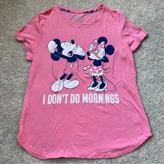 a pink shirt with mickey and minnie mouses on it that says i don't do mornings