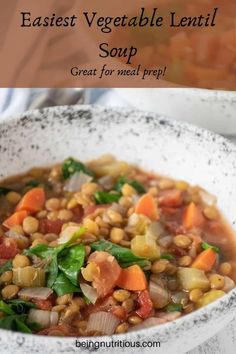 a white bowl filled with vegetable lentil soup