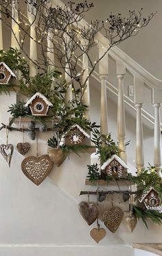 christmas decorations are hanging on the banister