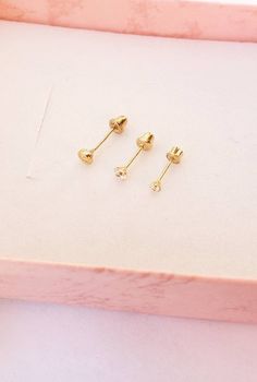 "14k GOLD STUDS SCREW Back Tiny CZ Safety Ball Backs Children's earrings Threaded back earring Hypoallergenic jewelry Multiple piercing Gift Teeny tiny Baby studs Small Real 14K gold Studs birthday gift for a baby 1st birthday Delicate and cute handmade with love: - 2mm - 3mm -3.5mm - cubic zirconia studs - round cut CZ set in 4 prongs - solid 14K yellow gold setting - soft ball threaded ball backs for comfort and no pain against the skin. 4 STYLES AVAILABLE: -2mm PRONG SET 14k yellow gold ( 8.1 Gold Huggie Cartilage Earrings As Gift, Yellow Gold Screw Back Piercings For Gifts, Yellow Gold Screw Back Piercings As Gift, Gold Plated Piercings As Gift, Dainty Gold Piercings With Birthstone, Adjustable Gold Cartilage Earrings As Gift, 14k Gold Filled Piercings, 14k Gold Filled Piercings For Pierced Ears As Gift, Hypoallergenic Gold Cartilage Earrings As Gift