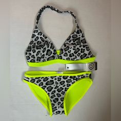 Brand New! Glide Soul Bikini. Both Top And Bottom Are Size Medium. Top Is Halter Style. Fabric Is Like A Light Neoprene, 0.5mm. Very Flexible And Smooth, With Stretch. Gray Animal Print With Neon Yellow Accents. On The Tag, It’s Called: Leopard/Lemon Questions And Offers Welcome! Please Check Out The Rest Of My Closet - I Offer Additional Discounts On Bundles. Neon Yellow Stretch Swimwear For Swimming, Neon Yellow Stretch Swimwear, Yellow Summer Swimwear For Sports, Yellow Summer Sports Swimwear, Neon Yellow Stretch Sleeveless Swimwear, Neon Yellow Fitted Triangle Top Swimwear, Fitted Neon Yellow Triangle Top Swimwear, Yellow Fitted Halter Neck Tankini, Casual Yellow Halter Neck Swimwear