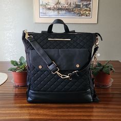 Excellent Condition With No Damage Or Tear. Huge And Great Travel Too Or Diaper Bag. Elegant Rectangular Backpack For On-the-go, Elegant Large Capacity Backpack For On-the-go, Luxury Large Capacity Shoulder Backpack, Luxury Satchel Backpack For Travel, Luxury Laptop Bag With Adjustable Strap For On-the-go, Chic Black Travel Bag With Detachable Strap, Luxury Large Capacity Backpack For Errands, Luxury Crossbody Backpack With Removable Pouch, Black Travel Bag With Detachable Handle For On-the-go