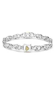 A pavé diamond–adorned center link brings fiery sparkle to this stunning bracelet crafted from interlocking circles made of 18-karat gold and sterling silver. Push-clasp closure Total diamond weight: 0.18ct. Color: G–H Clarity: SI Sterling silver/18k gold/diamond Imported >Diamond Guide White Gold Link Bracelet For Anniversary, Anniversary White Gold Bracelet With Solid Link Construction, Anniversary White Gold Bracelet With Solid Link, Anniversary White Gold Bracelet, Diamond Guide, Bracelet Crafts, Anniversary Sale, G H, Pave Diamonds