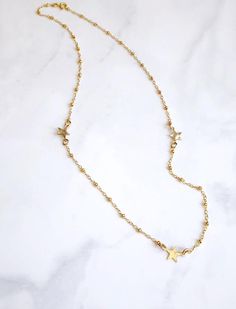 This simple little necklace is so flattering and versatile.  It’s beautiful on its own and also looks great as a layering necklace.   It features three small 14kt gold filled star charms spaced out on the chain. The stars are hammered with a dappled texture to catch the light.  The stunning chain is a 14kt gold filled bead chain. It is finished with a spring ring clasp and my signature large end ring. It has an extender to make the length adjustable to 16-18”. Dainty Star-shaped 14k Gold-filled Necklace, Dainty 14k Gold-filled Star Necklace, Dainty 14k Gold Filled Star Necklace, Dainty Star Charm Necklace For Everyday, Delicate Everyday Necklace With Star Charm, Dainty 14k Gold Filled Star Charm Necklaces, Dainty 14k Gold Filled Star Charm Necklace, Dainty Star Necklace For Everyday Wear, Davidson Nc