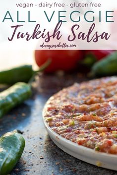 there is a pizza on the table with vegetables in the background and text overlay that reads heal thy turkish salsa