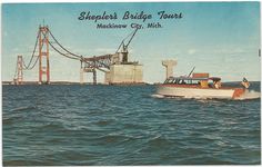 a boat in the water near a bridge