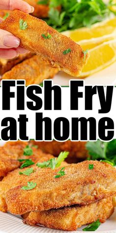 fish fry on a plate with lemons and parsley