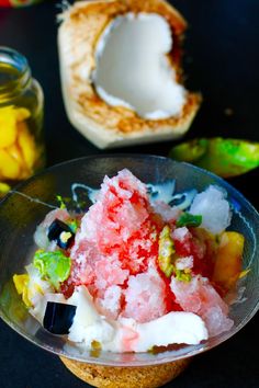 a bowl filled with ice cream and fruit