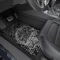 the interior of a car with a black and white floor mat