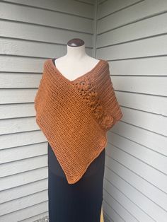 This beautiful daisy crochet granny square poncho wrap is versatile and can be worn casually or dressed-up.  It is lightweight and made as a wrap attached with 4 granny squares, allowing the front to look like a poncho and a wrap from the back.  The way the daisy's are made gives the ponchos a very elegant but casual look.   This item is made to order.  The colors shown in the pictures are cream, grey, black, white and navy blue.  If you like this style but would like a different color please message me.  If the color is available I can make the adjustments. The poncho should be washed in cold water on delicate in the washer and laid out flat to dry.   Made in a smoke-free, pet-free home. Daisy Crochet Granny Square, Crochet Poncho Granny Square, Fall Crochet Poncho Made Of Yarn, Fall Beach Shawl With Crochet Details, One Size Granny Square Poncho For Fall, Fall Beach Crochet Shawl, Fall Bohemian Poncho With Granny Squares, One Size Crochet Yarn Poncho, Crochet Flower Poncho Free Pattern