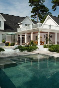 a house with a pool in front of it