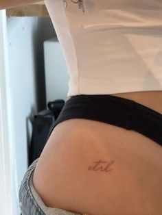 a woman's stomach with the word love written on it