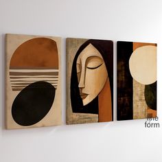 two abstract paintings on the wall one with a woman's face and another with a man's head