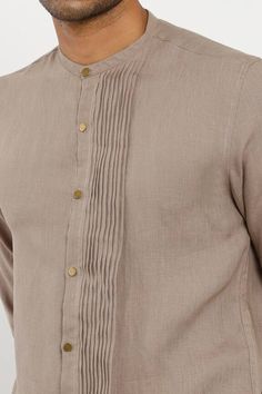 Stone slim-fit kurta with pleated panel, mandarin collar and cuff button placket. Component: 1 Neckline: Mandarin Sleeve Length: Full Fabric: 100% Linen Color: Brown Cuff button placket Note: Pant worn by the model is not for sale - Aza Fashions Linen Kurta For Men, Kurta Shirt For Men, Kurta Designs Men's, Short Kurta For Men, Short Kurtas, Wedding Kurta For Men, Kurta For Men, Mandarin Collar Shirt