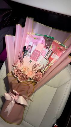 a car filled with lots of pink items in it's back seat and flowers