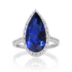 a pear shaped blue sapphire and diamond ring