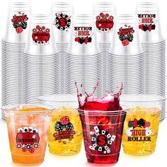 a bunch of cups with different designs and colors on them, all in plastic cups