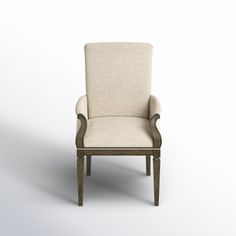 an upholstered chair with arms and legs on a white background, the seat is made out of wood