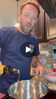 a man pouring something into a bowl on top of a stove with a spatula