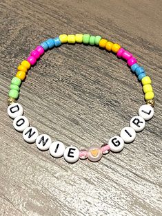 Neon New kids on the block seed bead bracelets. Show off your love for your favorite New Kid by choosing Danny,Donnie,Jordan,Joe or Jon Girl. See options in drop down menu. Standard size is a 7 Inch bracelet. Please message me for custom sizing. Great gift for the Magic Summer concert! Cute Adjustable Letter Beads, Cute Beaded Name Bracelet With Round Beads, Personalized Cute Beaded Bracelets, Cute Round Beaded Bracelets With Letter Beads, Playful Beaded Bracelets For Jewelry Making, Neon Bracelets, New Kids On The Block, Summer Concert, Kids On The Block