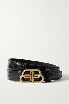 Balenciaga's 'BB' waist belt is named after its gold buckle, which is cast to resemble the brand's interlocking logo. It's been made in Italy from glossy black croc-effect leather and has a slim, 3cm width. Wear yours with everything from jeans to dresses. Balenciaga Crocs, Leather Waist Belt, Black Balenciaga, Balenciaga Women, Balenciaga Black, Balenciaga Belt, Metallic Leather, Black Belt, Waist Belt