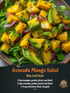 a salad with mangos, avocado and red onion on it in a bowl