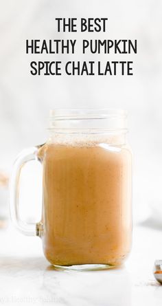 the best healthy pumpkin spice chai latte in a mason jar with text overlay