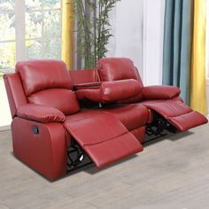 a red leather reclining sofa in a living room