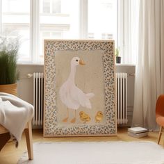 a white duck sitting next to a radiator in front of a painting on the wall