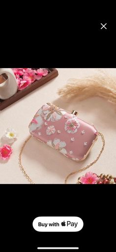 Our Pastel Pink Printed Sequin clutch is a must-have for this season! From lehengas to Indo-western, this clutch is capable of giving you the regal & chic look. Be ready to handle the spotlight! Embroidered front. Dimensions (LxB): 8"x4 Handle length: 47" Material: Embroidered poly silk, poly satin lining, metal clutch frame, gold metal sling. Features: metal lock closure, detachable metal sling. Pink Box Bag With Detachable Handle For Party, Spring Party Shoulder Bag Clutch, Elegant Handheld Box Bag For Spring, Party Clutch For Spring Season, Pink Portable Clutch Shoulder Bag, Spring Party Crossbody Clutch, Handheld Shoulder Bag For Spring Formal Events, Spring Rectangular Evening Bag, Summer Evening Clutch With Detachable Handle