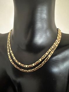 A Timeless Treasure: Vintage 18K Yellow Gold Flat Marina Chain Necklace Indulge in the luxury of vintage with this exquisite 18 carat yellow gold flat marina chain necklace. The intricate design adds  visual interest to the classic marina chain design. In great vintage condition.  5.75 grams. 50.5cm/ 19.88 inches. 2.5mm width.  Key Features: Vintage: A stunning piece of jewellery history, offering a touch of timeless elegance. 18K Yellow Gold: The high-quality gold ensures exceptional durability and a lustrous finish. Length: The necklace is 50.5 cm long, providing ample versatility. Width: The chain is 2.5 mm wide, offering a balanced and stylish look. Marked: The necklace is marked, guaranteeing its authenticity. My model is NOT human size.  Perfect for: Collectors of vintage jewellery T Gold Flats, Chain Design, Elegant Accessories, Timeless Treasures, Gold Texture, Vintage Jewellery, Intricate Design, Sheffield, Stylish Accessories