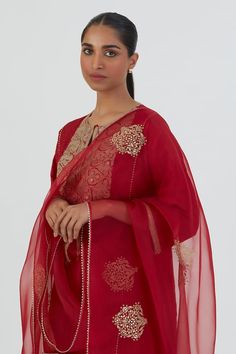 Red silk kurta featuring thread embroidered floral motifs on bodice highlighted by sequin embellishments. Comes with pant. - Aza Fashions Intricate Embroidery Churidar With Traditional Drape, Festive Cotton Silk Palazzo Set With Intricate Embroidery, Red Fitted Churidar With Chikankari Embroidery, Intricate Embroidery Churidar For Festive Occasions, Elegant Red Churidar With Intricate Embroidery, Elegant Red Churidar With Sheer Dupatta, Elegant Red Blouse With Resham Embroidery, Red Chanderi Blouse Piece With Intricate Embroidery, Red Unstitched Blouse Piece With Intricate Embroidery