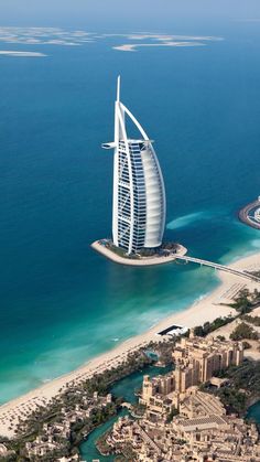 an aerial view of the burj in the middle of the ocean