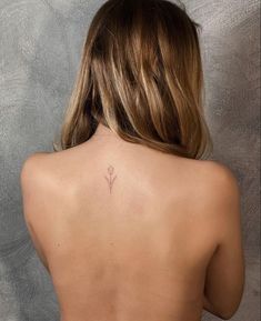 a woman with a tattoo on her back