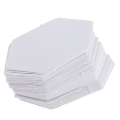 stack of white envelopes stacked on top of each other in front of a white background