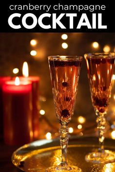 two champagne glasses sitting on top of a gold tray with candles in the background and text overlay reading cranberry champagne cocktail