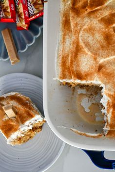 there is a cake that has been cut in half and on the plate next to it