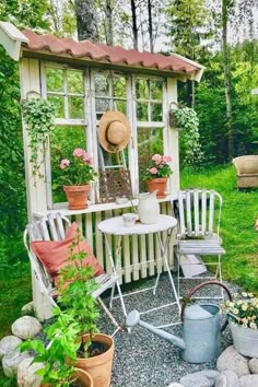 a garden shed with potted plants and chairs