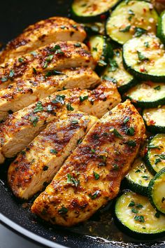 grilled chicken with zucchini and sliced cucumbers in a skillet