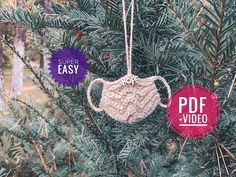 two crocheted masks hanging from a tree with the words super easy on them