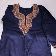 Brand New Never Worn Beautiful Navy Blue Blouse With Long Sleeves Hand Made Detailed Embroidery. Pictures Do Not Do It Justice. Size Large. Traditional Blue Top For Eid, Blue Long Sleeve Top With Resham Embroidery, Festive Blue Tops With Intricate Embroidery, Festive Blue Top With Floral Embroidery, Festive Blue Top With Intricate Embroidery, Blue Traditional Top With Resham Embroidery, Blue Tops With Intricate Embroidery In Traditional Style, Blue Floral Embroidered Tops For Eid, Festive Blue Embroidered Top With Intricate Details