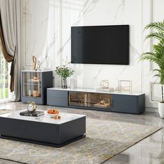 a modern living room with marble floors and white walls, large television on the wall