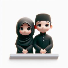 two figurines are standing next to each other on a white surface and one is wearing a black hijab