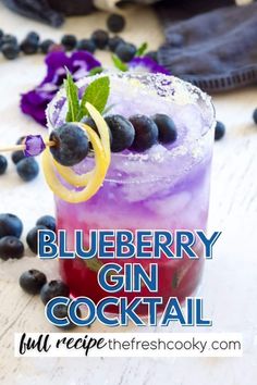 blueberry gin cocktail with lemon and mint garnish