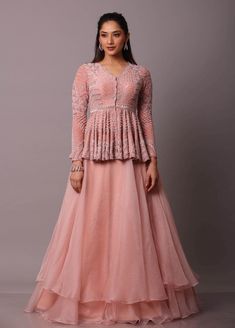 Disha Patil | Pink Embellished Peplum With Layered Skirt | INDIASPOPUP.COM Long Blouse Designs, Simple Frock Design, Long Frock Designs, Floral Frocks, Long Gown Design, Tiered Dresses, Frock For Women, Stitching Dresses, Festival Skirts