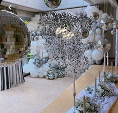 a room filled with lots of silver and white decorations