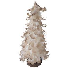 a white feather christmas tree is shown on a black base and stands in front of a white background