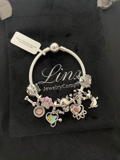 a silver bracelet with charms on it