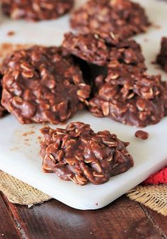 chocolate cookies are on a white plate